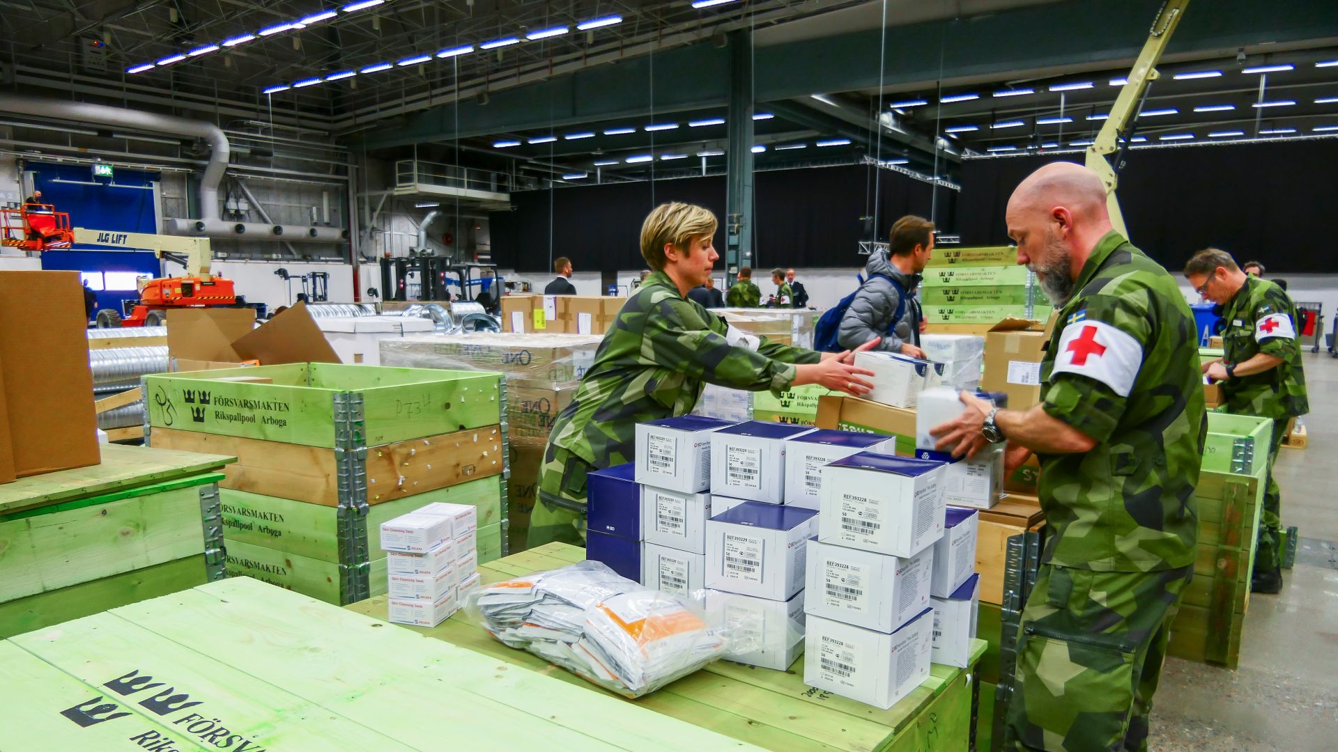 Army medical workers unpacking emergency supplies at a field hospital in Sweden