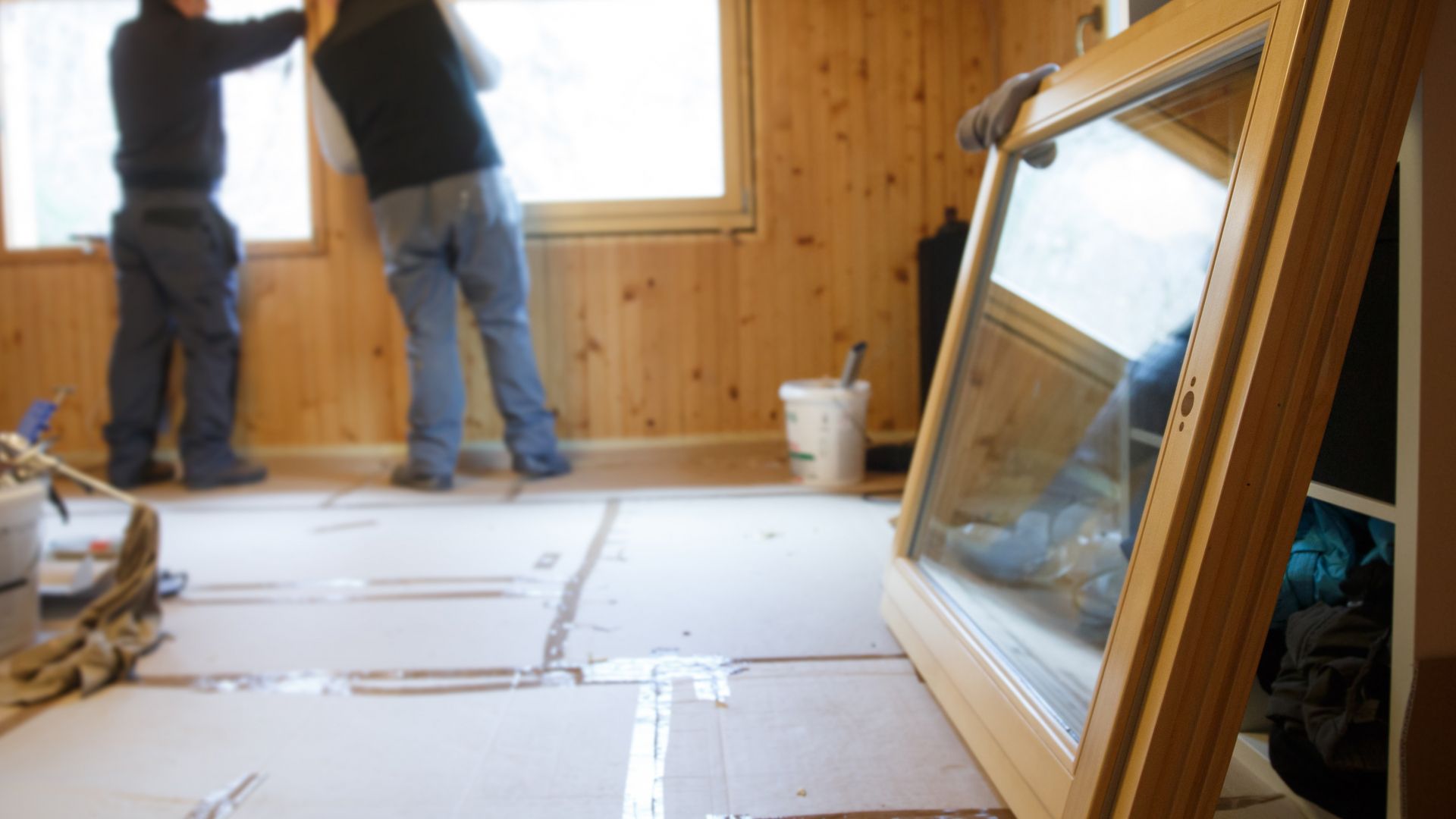 Workers installing new energy-efficient windows