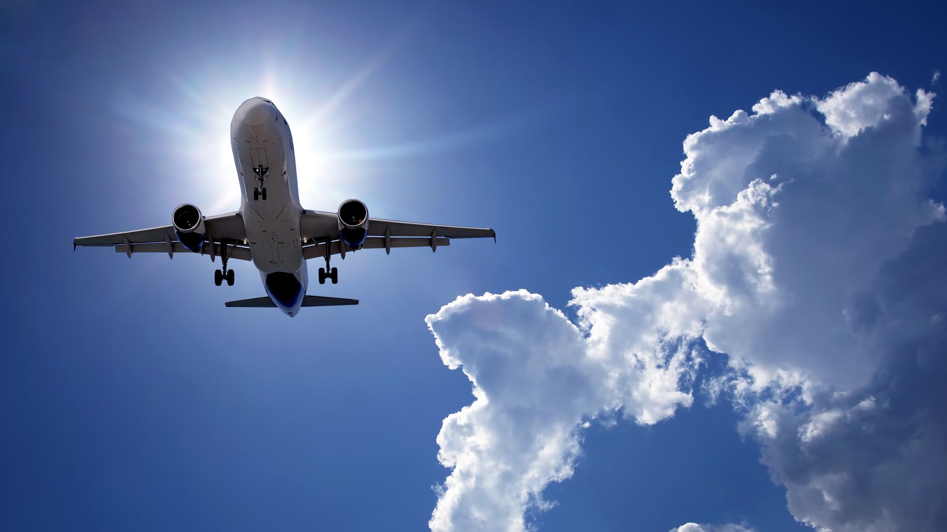 Passenger plane flying in blue sky