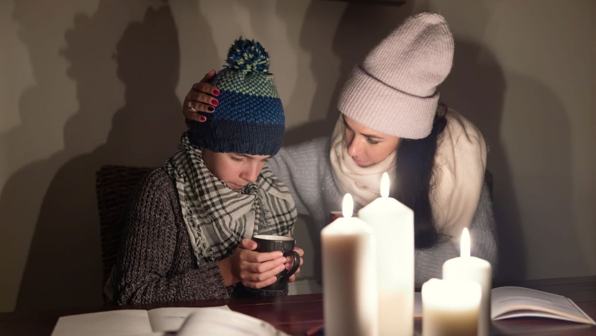 Women and child in home without heating and light