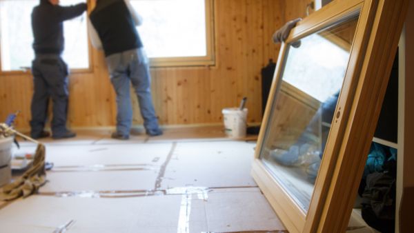 Workers installing new energy-efficient windows