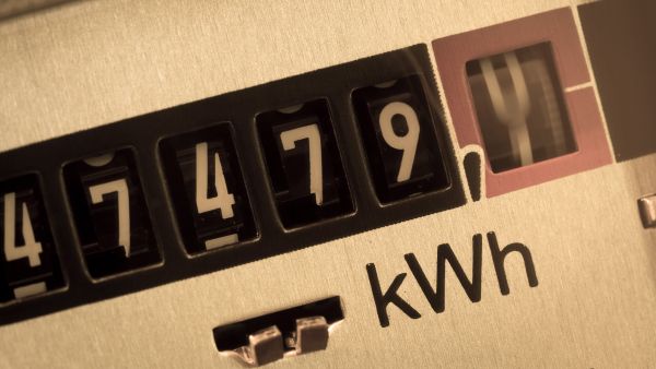 energy meter showing moving dial with kWh
