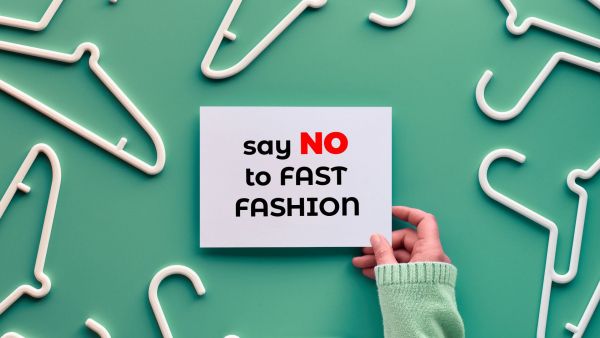 hangers and message "say no to fast fashion"