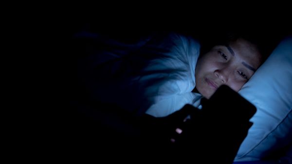 Phone addiction woman dark night sleep