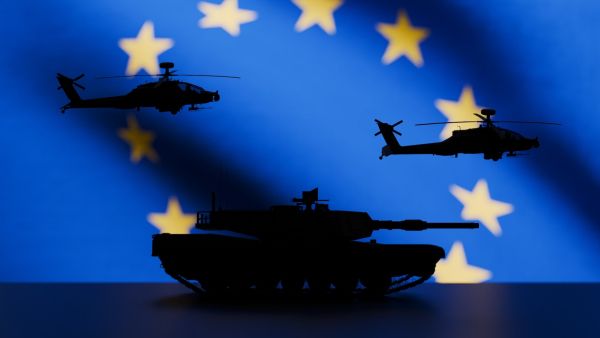 silhouette of helicopters and tank with EU flag in the background