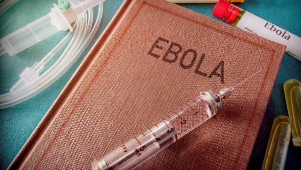 Syringe on a book  called Ebola