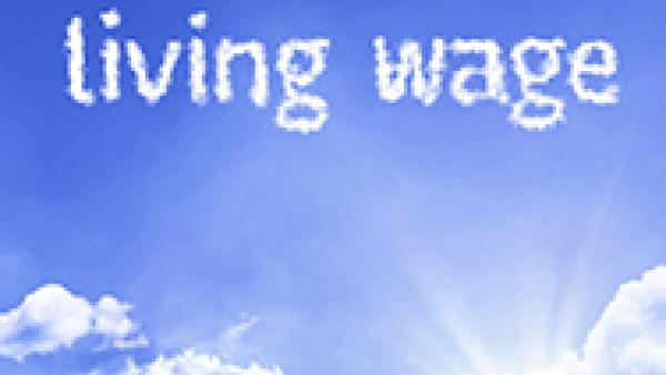 Living wage written in clouds on blue sky