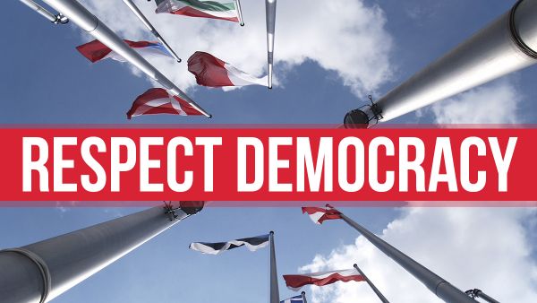 EU flags and words protect democracy