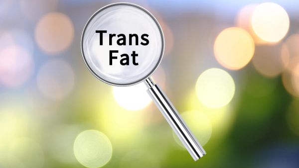 Magnifying glass with Trans Fat through it