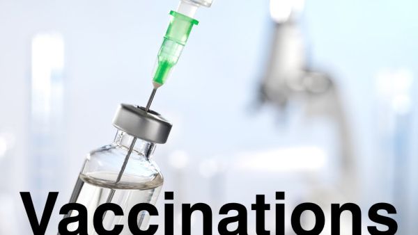 Needle in bottle of vaccine and word vaccinations